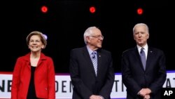 FILE - Then-Democratic presidential candidate Sen. Elizabeth Warren, D-Mass., waves to supporters and volunteers, Feb. 29, 2020, in Columbia, S.C.