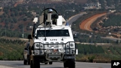 Spanish U.N. peacekeepers patrol the Lebanese Israeli border in the southern village of Odaisa, Lebanon, Aug. 29, 2013. 