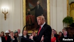 U.S. President Donald Trump speaks during a signing event for an Executive Order that establishes a National Council for the American Worker at the White House in Washington, U.S., July 19, 2018. 