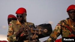 FILE - SPLA soldiers stand in a vehicle in Juba, December 20, 2013.