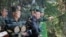 This Oct. 2, 2024, photo from North Korea's official Korean Central News Agency via KNS on Oct. 4, 2024, shows North Korea's leader Kim Jong Un, center, inspecting a training base of the Korean People's Army at an undisclosed location.