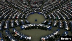 Members of the European Parliament take part in a voting session at the European Parliament in Strasbourg, France, July 3, 2013. 