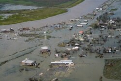 Buildings and homes are flooded in the aftermath of Hurricane Laura Aug. 27, 2020, in Cameron, La.