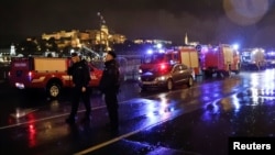 Police and fire brigade vehicles are seen on the Danube bank after а tourist boat capsized on the river, in Budapest, Hungary, May 29, 2019.