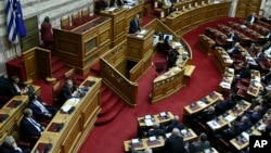 Former Prime minister Antonis Samaras delivers a speech during a parliament debate about Prespa Agreement in Athens, Greece, Jan. 24, 2019. 