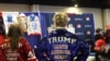 People wear merchandise in support of U.S. President Donald Trump at a vendor booth during the annual Conservative Political Action Conference at the Gaylord National Resort & Convention Center at National Harbor in Oxon Hill, Maryland, on Feb. 21, 2025.