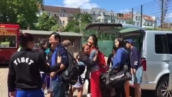 The Tibetan Women's Soccer team greet the Chinese team in Berlin, June 28, 2015.
