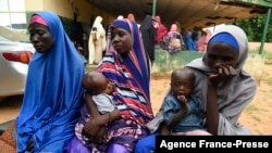 Victims Maryam Aliyu, center, Rabi Sa'adu, left, and Fatima Sal'Hatu narrate their ordeals with bandits at Bini primary health clinic, Wamako district of Sokoto, northwest Nigeria, Sept. 22, 2021. 