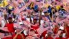 Young Malaysians wave flags during rehearsals for National Day celebrations, marking the anniversary of the country's independence, at the Independence Square in Kuala Lumpur, in this August 29, 2012 file photo. 