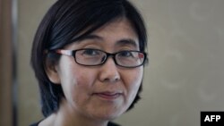 Wang Yu, the lawyer of late Chinese human rights activist Cao Shunli, poses during an interview in Hong Kong, March 20, 2014. 