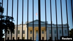 FILE - The White House is seen from outside the north lawn fence in Washington, D.C.