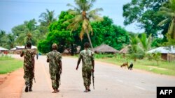 FILE - In this March 7, 2018, photo, soldiers from the Mozambican army patrol the streets after security in the area was increased following a two-day attack from suspected Islamists.