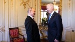 FILE - Russian president Vladimir Putin, left, talks with U.S. president Joe Biden during the U.S. - Russia summit in Geneva, Switzerland, June 16, 2021.