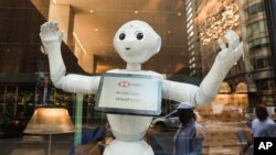 HSBC Bank welcomes SoftBank Robotics' humanoid robot, Pepper, to their team at the Fifth Ave branch on Monday, June 25, 2018 in New York. (Mark Von Holden/AP Images for HSBC)