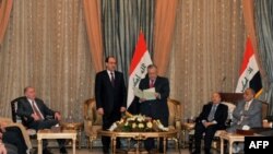 Tổng thống Iraq Jalal Talabani yêu cầu Thủ tướng đương nhiệm Nouri al-Maliki thành lập tân chính phủ, Baghdad, thứ Năm 25/11/2010