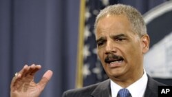 Attorney General Eric Holder gestures during a news conference at the Justice Department in Washington, April 11, 2012.