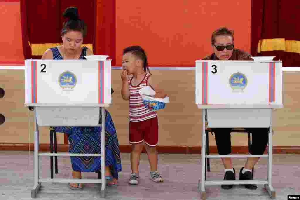 People vote at a polling station in presidential elections in Ulaanbaatar, Mongolia.