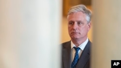 National security adviser Robert O'Brien listens as President Donald Trump addresses the nation, Jan. 8, 2020, from the White House on the ballistic missile strike that Iran launched against Iraqi air bases housing U.S. troops in Washington.