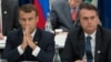 Presiden Perancis Emmanuel Macron (kiri) dan Presiden Brazil Jair Bolsonaro dalam KTT G20 di Osaka, Jepang 28 Juni 2019 lalu (foto: dok).