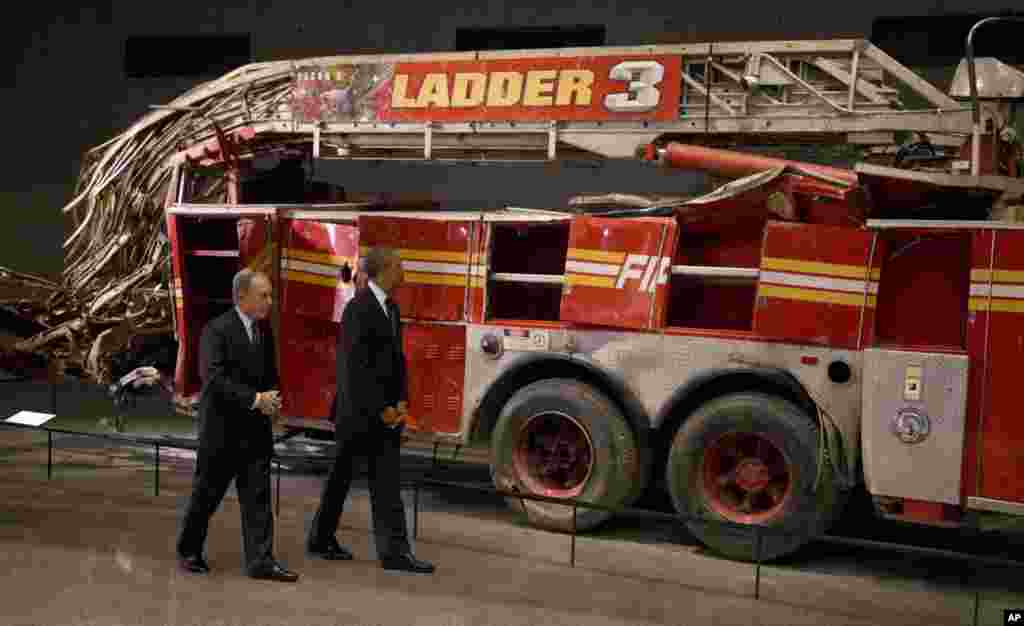 President Obama and former New York City Mayor Michael Bloomberg tour the destroyed Ladder 3 truck at the September 11 Memorial Museum, New York City, May 15, 2014.