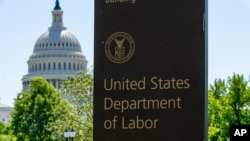 FILE - The entrance to the Labor Department is seen near the Capitol in Washington, May 7, 2020. 