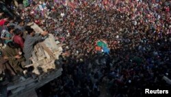 Kashmiri villagers carry body of rebel Sahir Ahmed, during his funeral procession in Arwani, 55 kilometers (35 miles) south of Srinagar, Indian controlled Kashmir, Oct. 26, 2018.