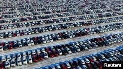 New cars are seen at a parking lot in Shenyang, Liaoning province, China, Jan. 16, 2017. 