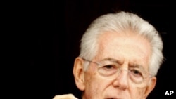 Italian Prime Minister Mario Monti briefs the media in Rome, Sunday, Dec. 4, 2011.