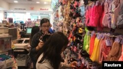 Young shoppers browse at a Claire’s store in the Newport Mall in Jersey City, New Jersey, Sept. 22, 2018. 