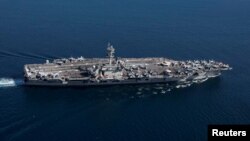 The Nimitz-class aircraft carrier USS Abraham Lincoln transits the Strait of Gibraltar, entering the Mediterranean Sea as it continues operations in the 6th Fleet area of responsibility, April 13, 2019.