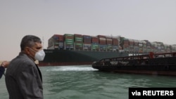 Osama Rabie, Chairman of the Suez Canal Authority, monitors the situation near stranded container ship Ever Given, one of the world's largest container ships, after it ran aground, in Suez Canal, Egypt, March 25, 2021.