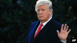 President Donald Trump waves as he leaves the White House in Washington, Oct. 24, 2018, to attend a campaign rally in Mosinee, Wisconsin. 