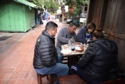 Danny Delatorre, 57, and his wife Norma Delatorre, 56, eat lunch at La Noche Buena restaurant after receiving their second coronavirus disease (COVID-19) vaccine shots, in Los Angeles, March 11, 2021.
