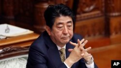 Japanese Prime Minister Shinzo Abe attends discussion about new law of Japan’s military role at the Upper House plenary session in Tokyo, Monday, July 27, 2015