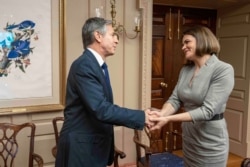 U.S. Secretary of State Antony Blinken greets Belarusian opposition leader Sviatlana Tsikhanouskaya at the State Department in Washington, July 19, 2021, in a photo posted by Tsikhanouskaya on her Twitter (@Tsihanouskaya).
