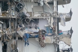 Part of a building is shown after a partial collapse, June 24, 2021, in Surfside, Fla.