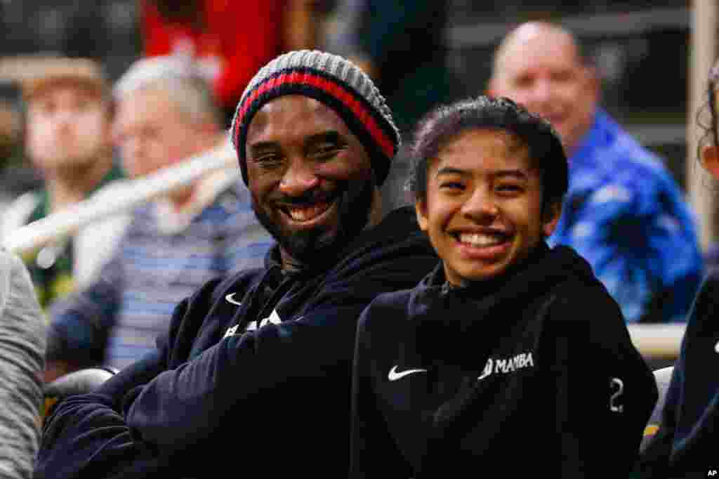 Former NBA star Kobe Bryant attends an NCAA women&#39;s college basketball game between Long Beach State and Oregon, Dec. 14, in Long Beach, Calif. 