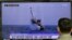 A South Korean man watches a TV news program showing an image published in North Korea's Rodong Sinmun newspaper of North Korea's ballistic missile believed to have been launched from underwater, at Seoul Railway station in Seoul, South Korea, Saturday, M