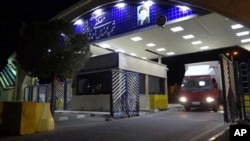 In this photo released on Nov. 6, 2019 by the Atomic Energy Organization of Iran, a truck containing cylinder of uranium hexafluoride gas leaves Ahmadi Roshan uranium enrichment facility in Natanz to Fordo nuclear facility.