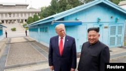 FILE - U.S. President Donald Trump meets with North Korean leader Kim Jong Un at the demilitarized zone separating the two Koreas, in Panmunjom, South Korea, June 30, 2019. 