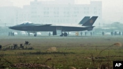 An aircraft that is reported to be a Chinese stealth fighter is seen in Chengdu, Sichuan province, in this picture leased by Kyodo news agency, 8 Jan 2011
