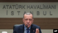 Turkey's President Recep Tayyip Erdogan speaks to reporters before leaving for Bosnia, in Istanbul, July 8, 2019. Erdogan said Russia's S-400 air defense missiles were being prepared to be flown to Turkey. 