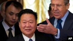 FILE - Russian Foreign Minister Sergei Lavrov, right, welcomes North Korean envoy Choe Ryong Hae during their meeting in Moscow, Nov. 20, 2014.