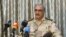 FILE - General Khalifa Haftar speaks during a news conference at a sports club in Abyar, a small town to the east of Benghazi.