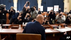 FILE - U.S. Ambassador to the European Union Gordon Sondland returns from a break to continue testifying before the House Intelligence Committee on Capitol Hill in Washington, Nov. 20, 2019.