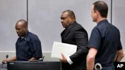 Jean-Pierre Bemba enters the courtroom of the International Criminal Court in The Hague, Netherlands, March 21, 2016. The court's judges handed him a guilty verdict.