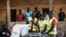 FILE - Election officials start counting votes at a polling station in the Bairro Militar area of the capital Bissau, in Guinea-Bissau, Nov. 24, 2019.