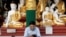 FILE - A man wears a face mask as he uses his phone at Shwedagon Pagoda in Yangon, Myanmar, Jan. 31, 2020.