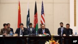 Afghan Foreign Minister, Salahuddin Rabbani, center, starts the meeting to discus a road map for ending the war with the Taliban at the Presidential Palace in Kabul, Afghanistan, Feb. 23, 2016. 