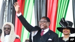 Malawi's newly elected President Lazarus Chakwera greets supporters after being sworn in in Lilongwe, Malawi, June 28 2020. 